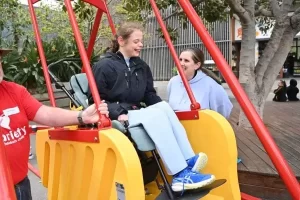 happy child on modified swing