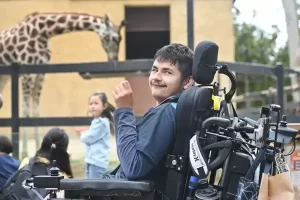 Happy child in wheel chair at Variety zoo experience